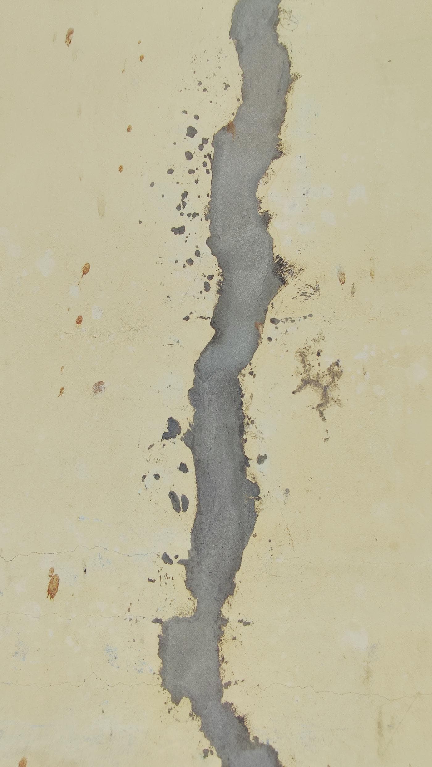 Close-up of a wall crack being filled during foundation crack repair for Ohio quote guidance